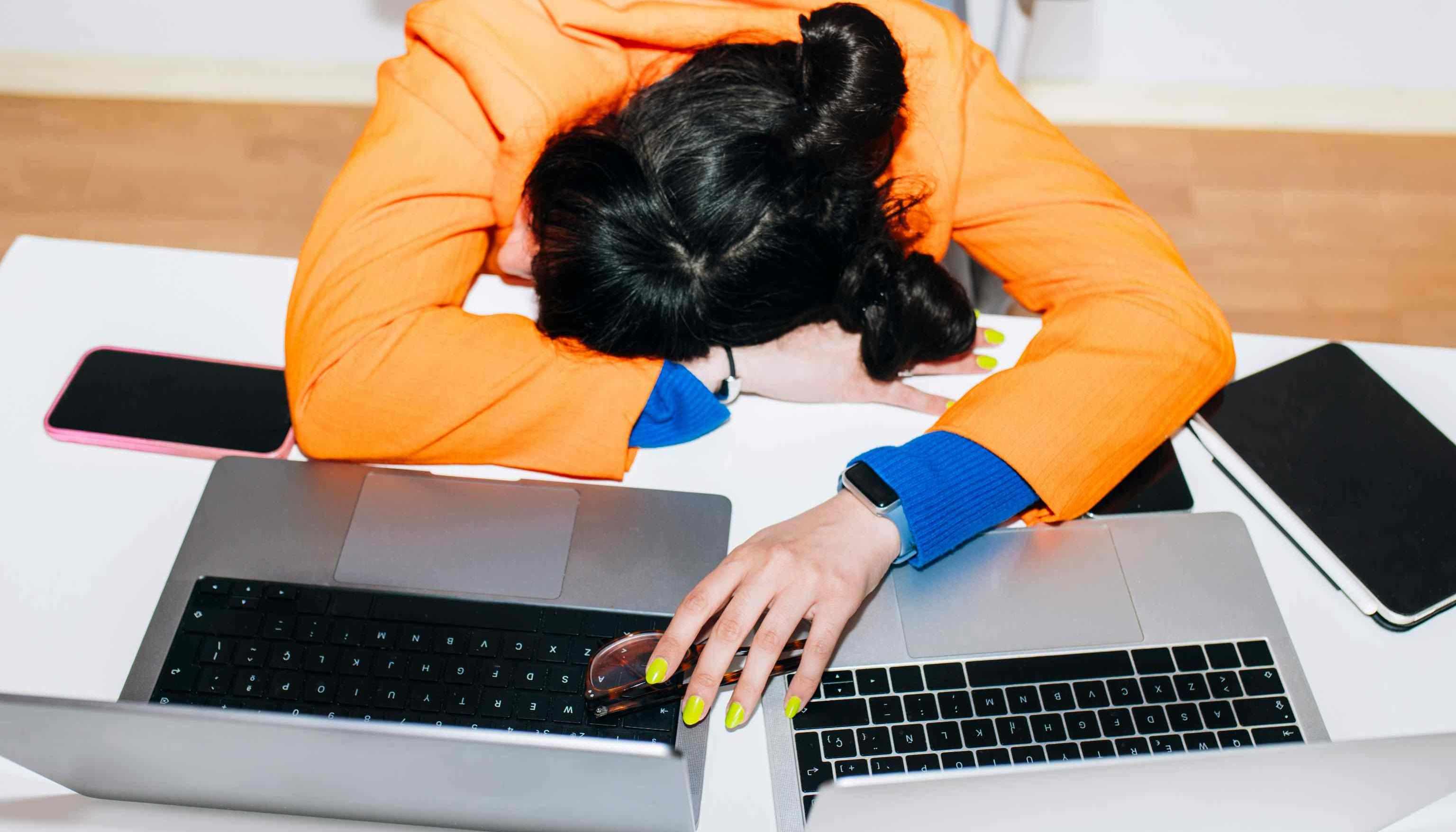 Tired person stressed by excessive text messages